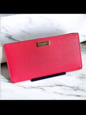 Kate Spade Darcy slim long bifold wallet in vibrant red leather retail $149